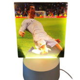 Huitich white football player desk lamp featuring a glowing image of a soccer player in white uniform sliding on the field